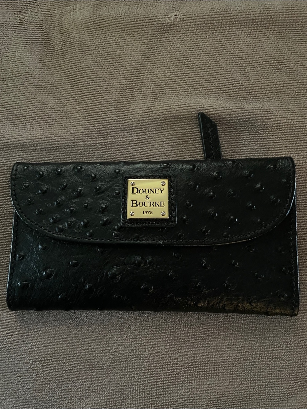 Dooney & Bourke Black Ostrich-Embossed Leather Clutch Wallet with Gold Plaque